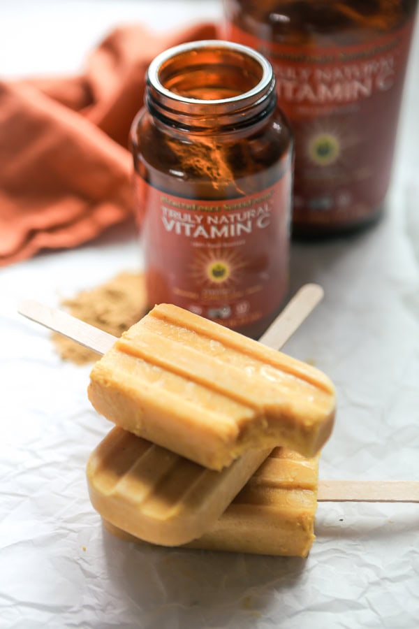 Orange Creamsicle Popsicles And A Bottle Of Truly Natural Vitamin C Powder